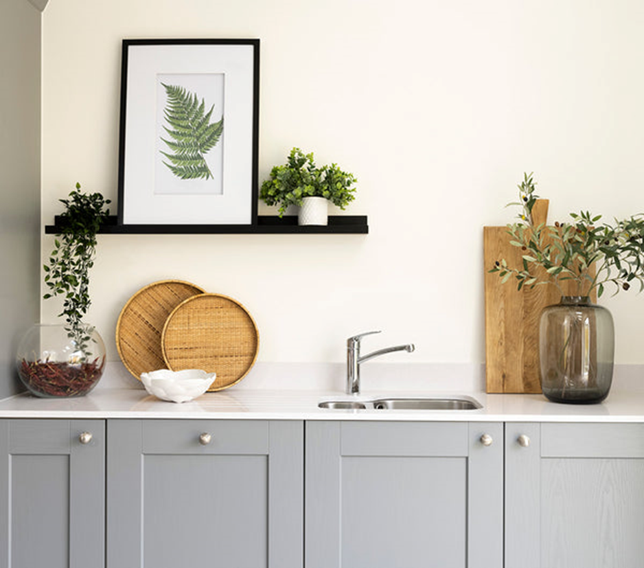 Stone bridge home designed by SW Design with greenery as part of the kitchen design.